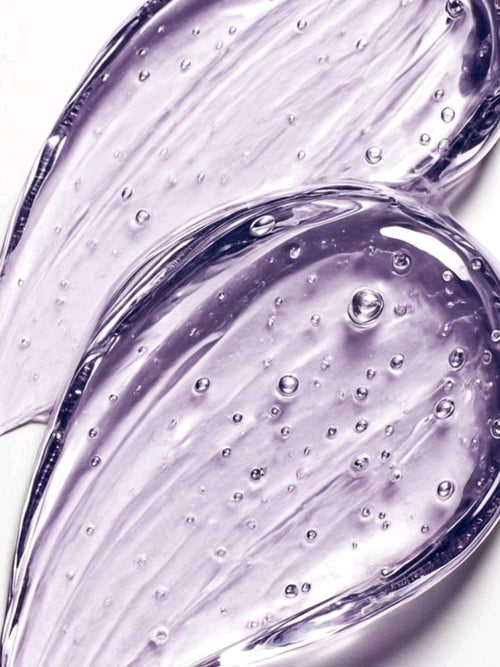 Close-up of purple gel with bubbles on a white background Grapes gel moisturizer- Fella Beauty 